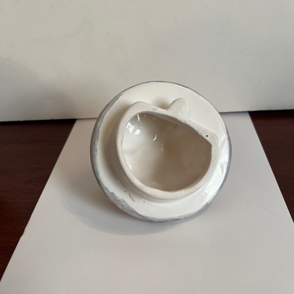Teapot w dog and trash can